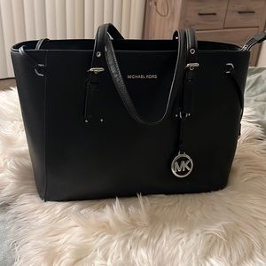 Black Michael Kors bag.